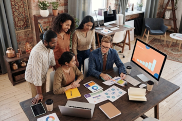 A small team planning a business brand and reviewing ideas together